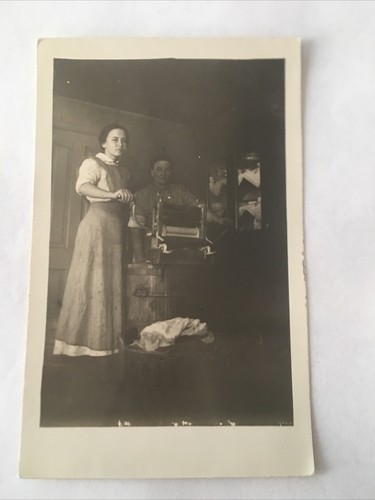 Women washing clothes wringer - washing,